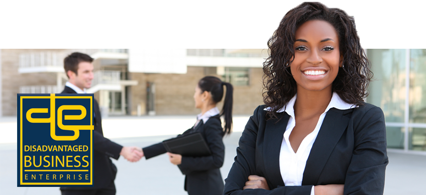 minority woman standing in front of a man and woman shaking hands