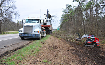 image of debris clearing on the the side of the interstate