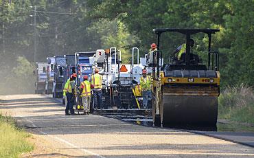 image of paving crew paving a secondary raod