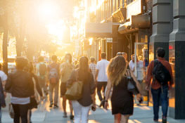 people walking along a sidewalk