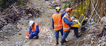 Seismic equipment being used on a new dirt road